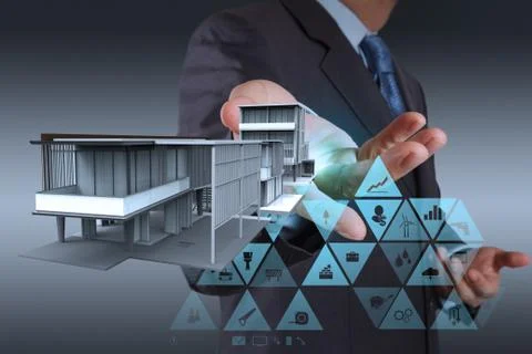 Engineer hand working with new computer interface show building development c Illustrazione stock