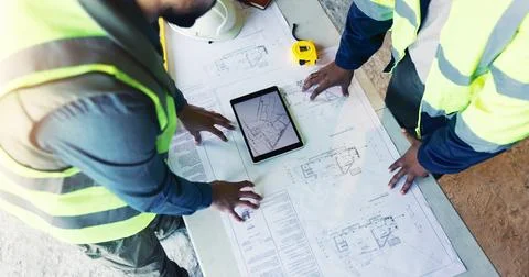 Engineer, hands and blueprint on tablet with team for project, meeting and .. 库存照片