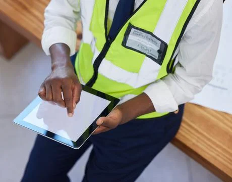 Engineer, hands and man with tablet screen while online for planning, schedule 写真素材