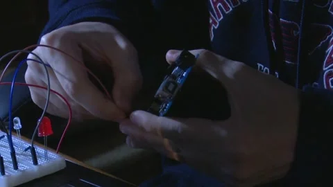 Engineer Hands Testing and Inspecting Electronic Circuit Board. Stock Footage 326352624