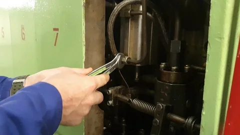 Engineer hands tighten bolting with two wrenches close view Stock Footage 121118334