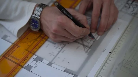 Engineer hands while working draws a plan, graph, by pencil and ruler Stock Footage 73169021