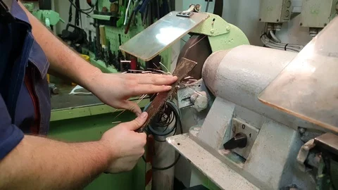 Engineer hands work on grinding machine with flying sparks Stock Footage 121118473