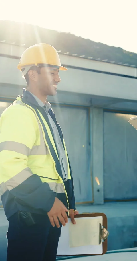Engineer, handshake and meeting at site with construction worker, tablet and Stock Footage 345580595
