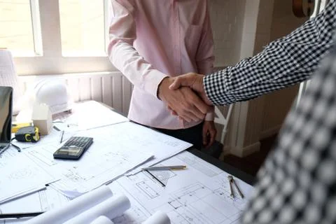 Engineer handshaking. architect shaking hands for building construction proje Stock Photos