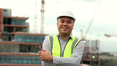Engineer handsome man walking smile and proud of the work with white safety. Stock Footage 164837202