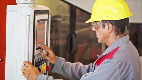 Engineer with hard hat  in the front of the control panel Stock Footage 70154567