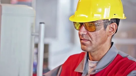 Engineer with hard hat  in the front of the control panel Stock Footage 70157819