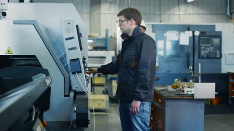 Engineer in Hard Hat is Setting Up CNC Lathe Machine 스톡 동영상 52321516