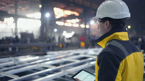 Engineer in Hard Hat is Walking Through Factory. Back View Stock Footage 237557202