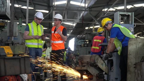 Engineer in Hard Hats and Inspector manager talking together and inspect mach Stock Footage 139820414