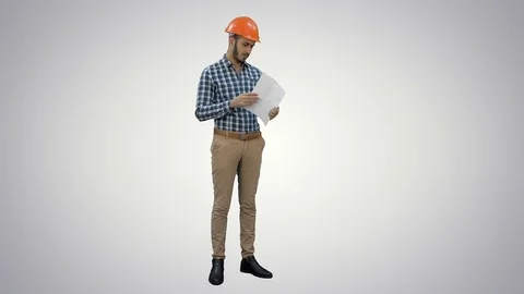 Engineer in hardhat examining construction plan on white background Vídeos de archivo 73641904