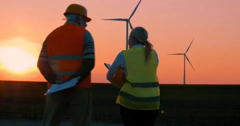 Engineer has finished checking the windmills and is going home Stock Footage 153932519