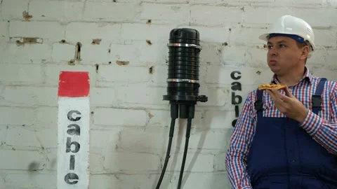 Engineer has lunch after the construction of communication lines Stock Footage 150635143