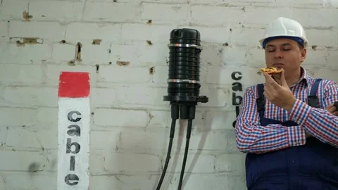 Engineer has lunch after the construction of communication lines Stock Footage 150645884