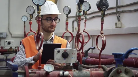 Engineer in heating supply works on location Stock Footage 84793941