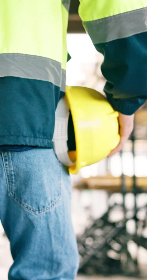 Engineer, helmet and hand of man walking at construction site for safety Stock Footage 340873707