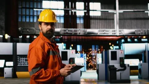Engineer with helmet, checking production process, heavy industry plant Stock Photos