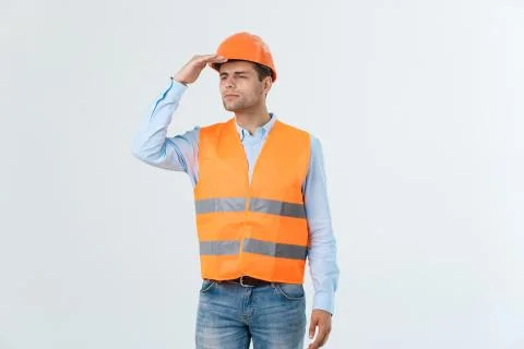 Engineer in a helmet looks to the side view side view Stock Photos