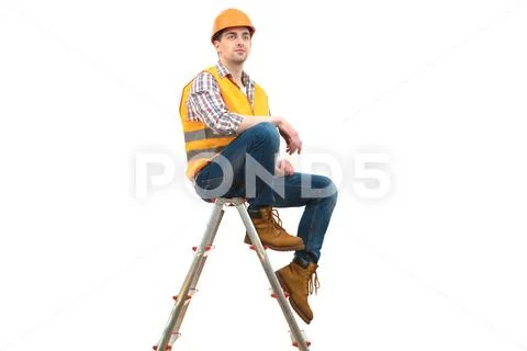 The engineer in helmet sitting on the ladder on the white background Stock Photos