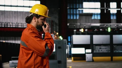 Engineer with helmet, two-way signal device, wireless radio communication Stock Footage 330030731
