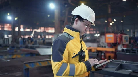 Engineer In Helmets With Tablet Device Stock Footage 237551578