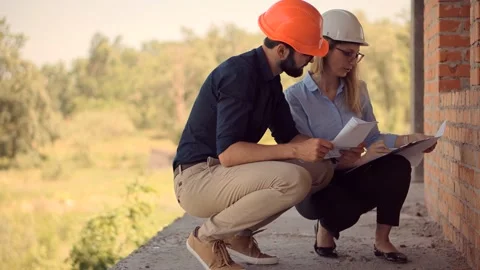 Engineer In Helmet.Two Architect Developer Inspecting Building Site Stock Footage 132517856