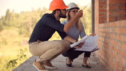 Engineer In Helmet.Two Architect Developer Inspecting Building Site Stock Footage 132518473