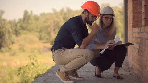 Engineer In Helmet.Two Architect Developer Inspecting Building Site Stock Footage 132518501