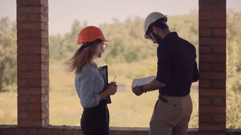 Engineer In Helmet.Two Architect Developer Inspecting Building Site Stock Footage 133216105