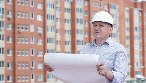 An engineer holding blueprints Stock Photos