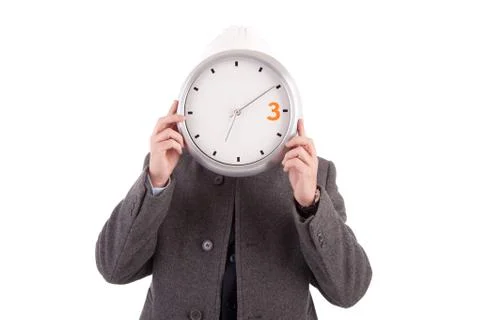 Engineer holding a clock Stock Photos