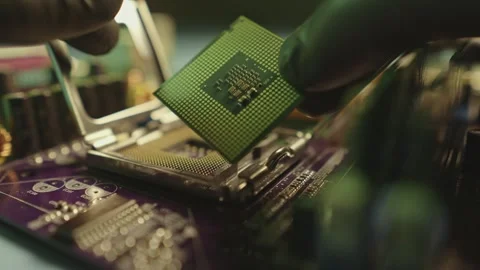 Engineer holding hands CPU to insert into the socket of the motherboard Stock Footage 284204745