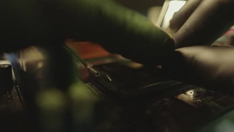 Engineer holding hands CPU to insert into the socket of the motherboard Stock Footage 284204835