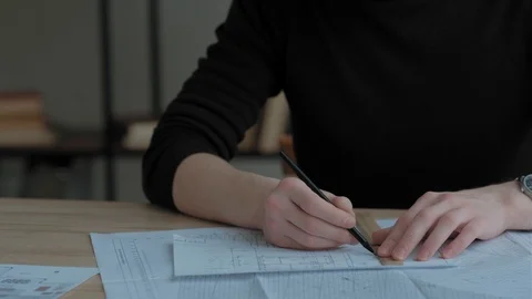 Engineer holding pencil and makes a line with ruler. Drawing blueprint Video stock 124985451