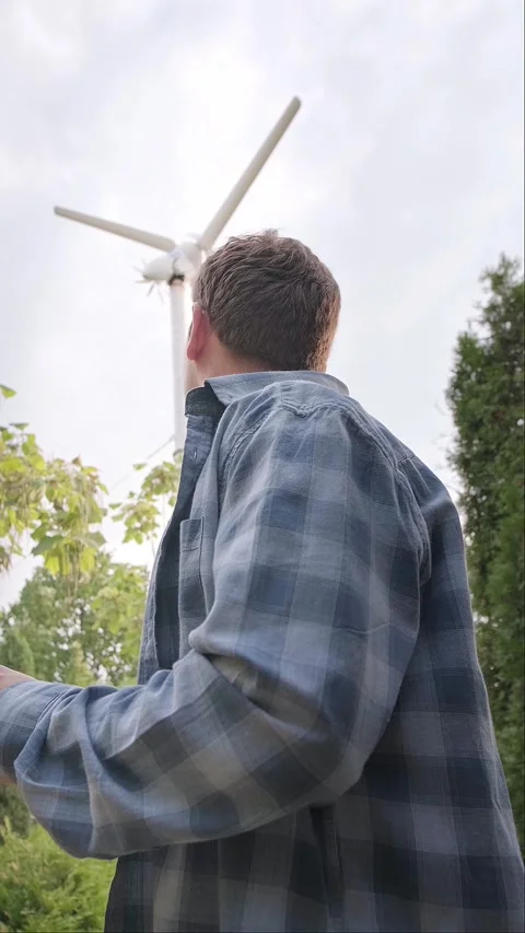 Engineer holding a phone, working on improving the design and technical specific Stock Footage 300250804