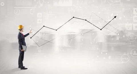 Engineer holding a plan and standing with graphs, charts and reports on the 스톡 사진