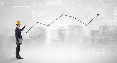 Engineer holding a plan and standing with graphs, charts and reports on the 스톡 사진