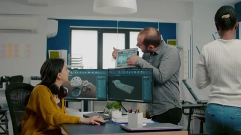 Engineer holding tablet showing to manager 3D gears Video stock 152795841