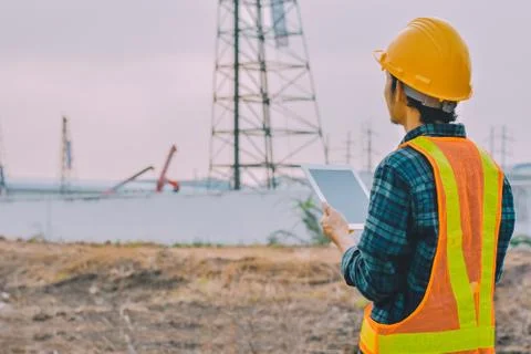 Engineer holding tablet working inspection building construction Stock Photos