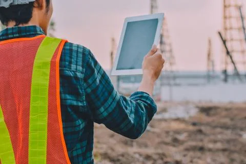 Engineer holding tablet working inspection building construction Stock Photos