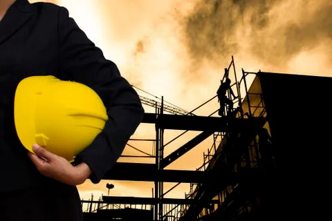 Engineer holding Yellow helmet Foto stock