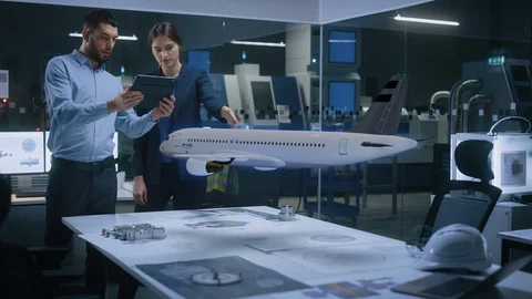 Engineer Holds Tablet Computer, Showing Augmented Reality Airplane Jet Engine Stock Footage 128854445