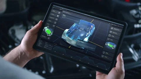 Engineer holds tablet with simulation of car diagnostics displayed on screen Video stock 252632823