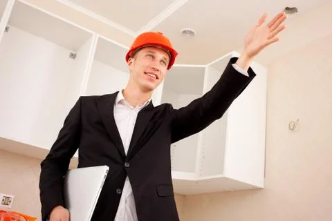 Engineer indicates the direction of hand Stock Photos