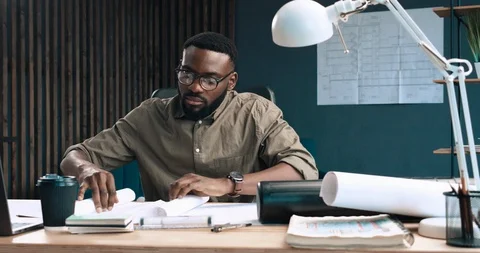 Engineer inspect architectural plan, sketching a construction project. Portrait Stock Footage 126235728