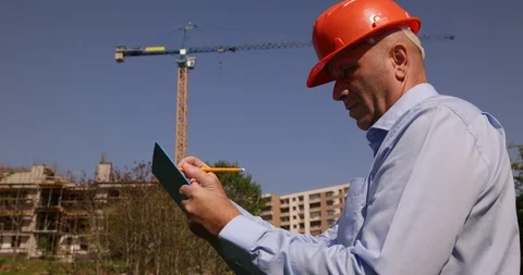 Engineer Inspect a Building in Construction and Take Notes Using a Clipboard Stock-Footage 109090800