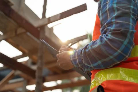 Engineer is inspecting construction and quality assurance new house using a.. Foto stock