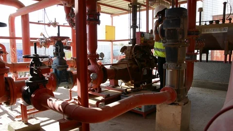 Engineer inspecting machinery water pump. checks the pump sprinklers Video stock 115045087
