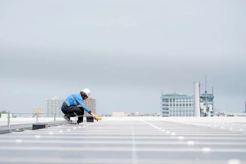Engineer inspection solar panel installation on rooftop, checking photovolt.. 写真素材